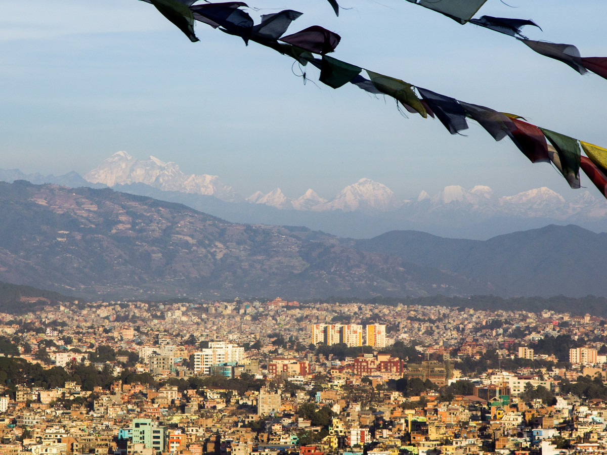 View of Kathmandu with prayer flags flapping in wind